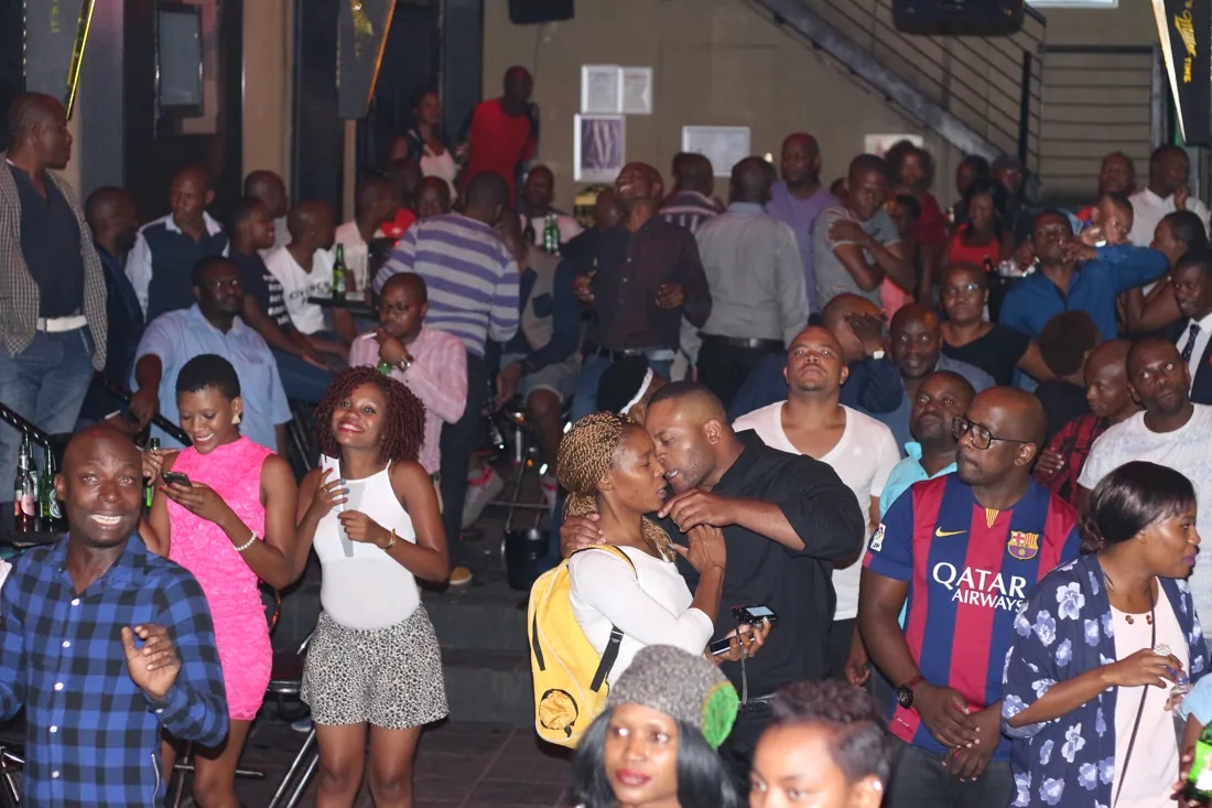 A lively crowd enjoying karaoke at Blue Room Central