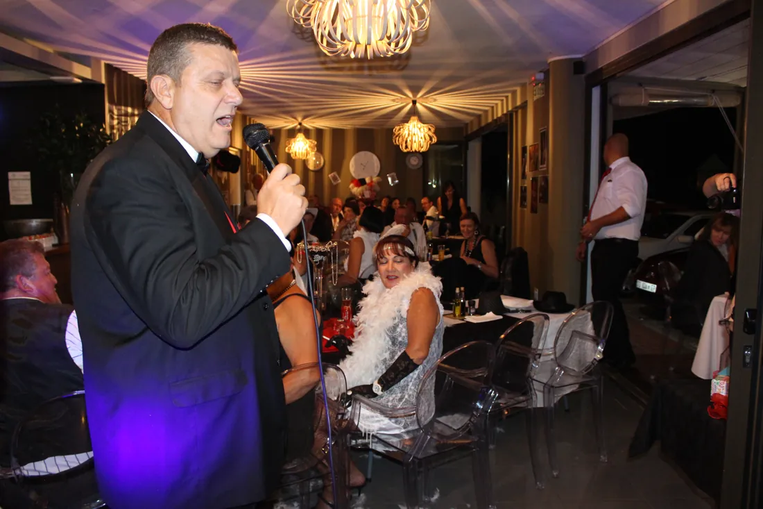A guest singing at a birthday celebration