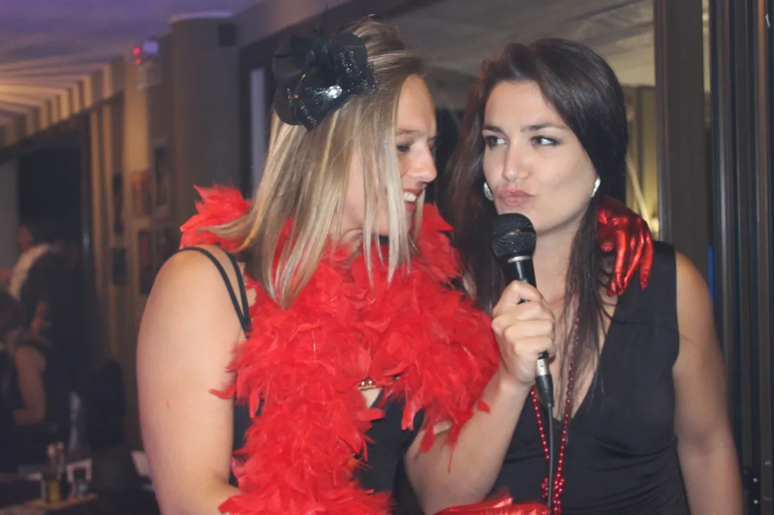 Two friends sharing a karaoke duet