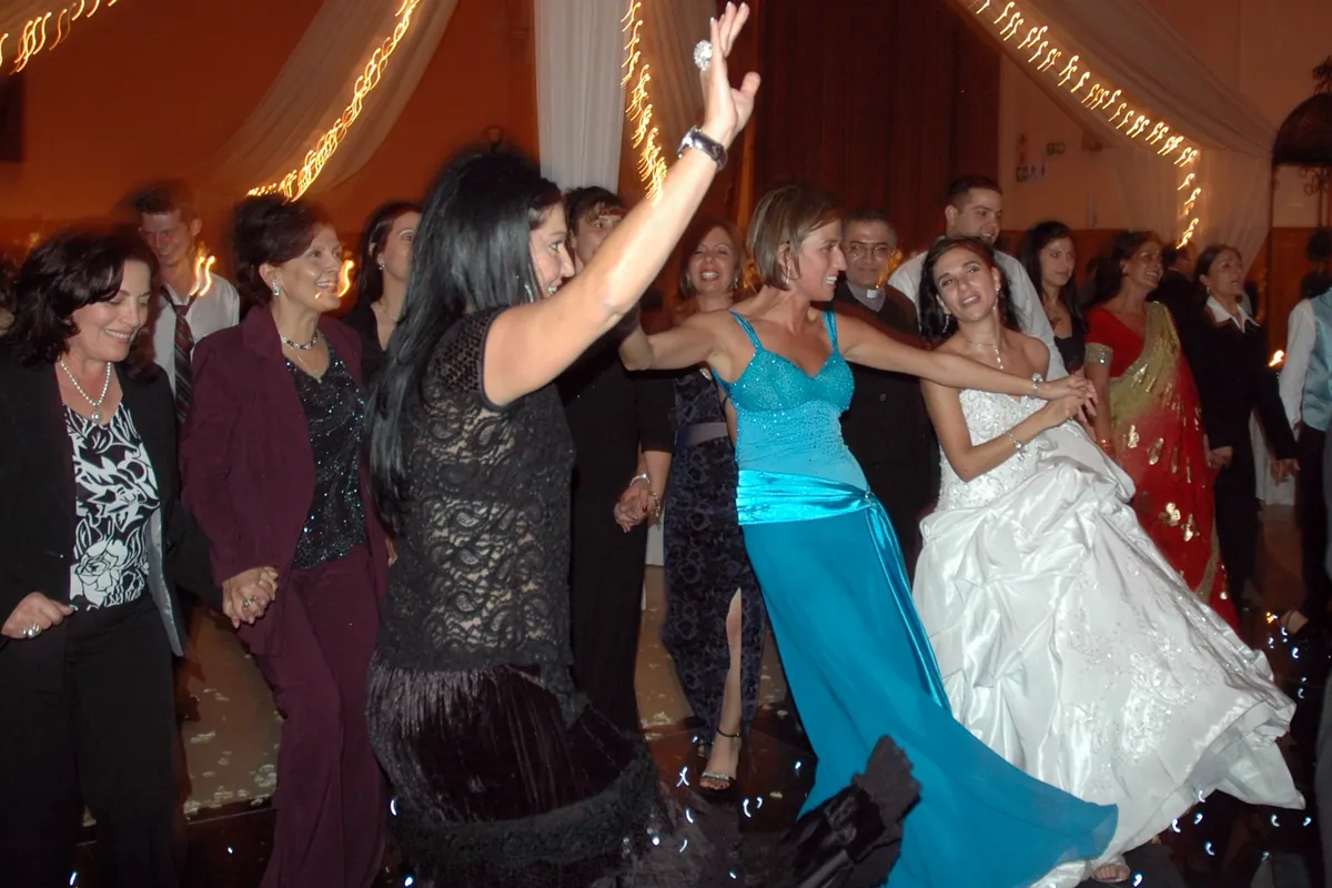 Bride and guests celebrating together on the dance floor