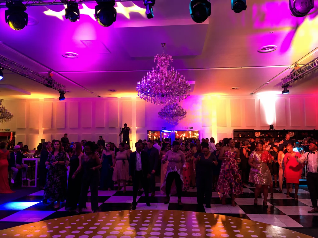 Guests enjoying a colourful corporate celebration on the dance floor