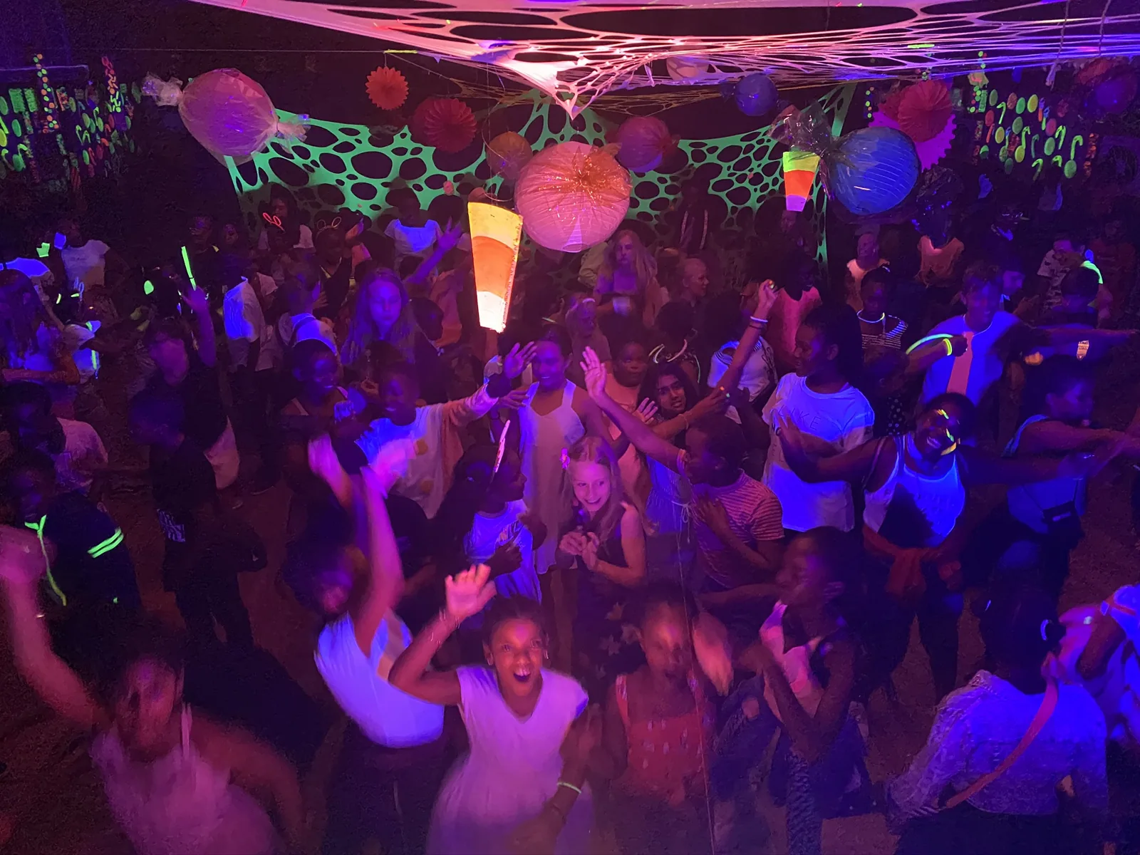 Students celebrating at a colourful school dance